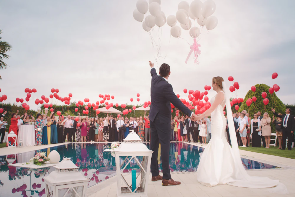 Guests seated at an outdoor wedding ceremony